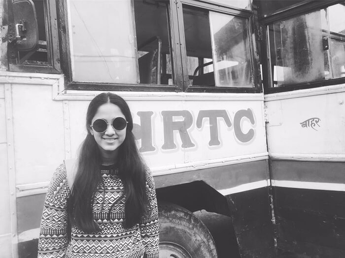 Lehan posing besides a bus in Spiti Valley